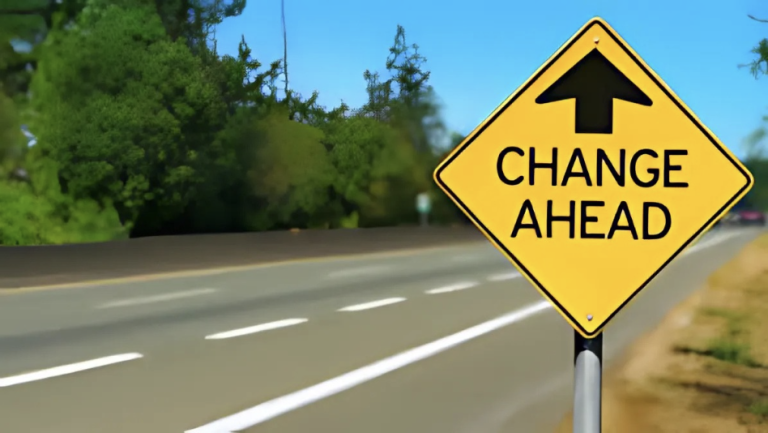 A street sign, saying "Change Ahead"